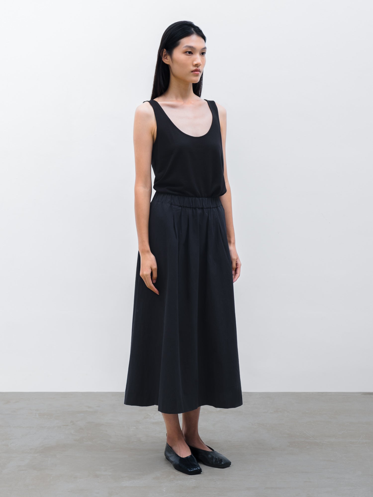 Women Kair Tencel Relaxed Tank in Black and Pleated Maxi Skirt in Black